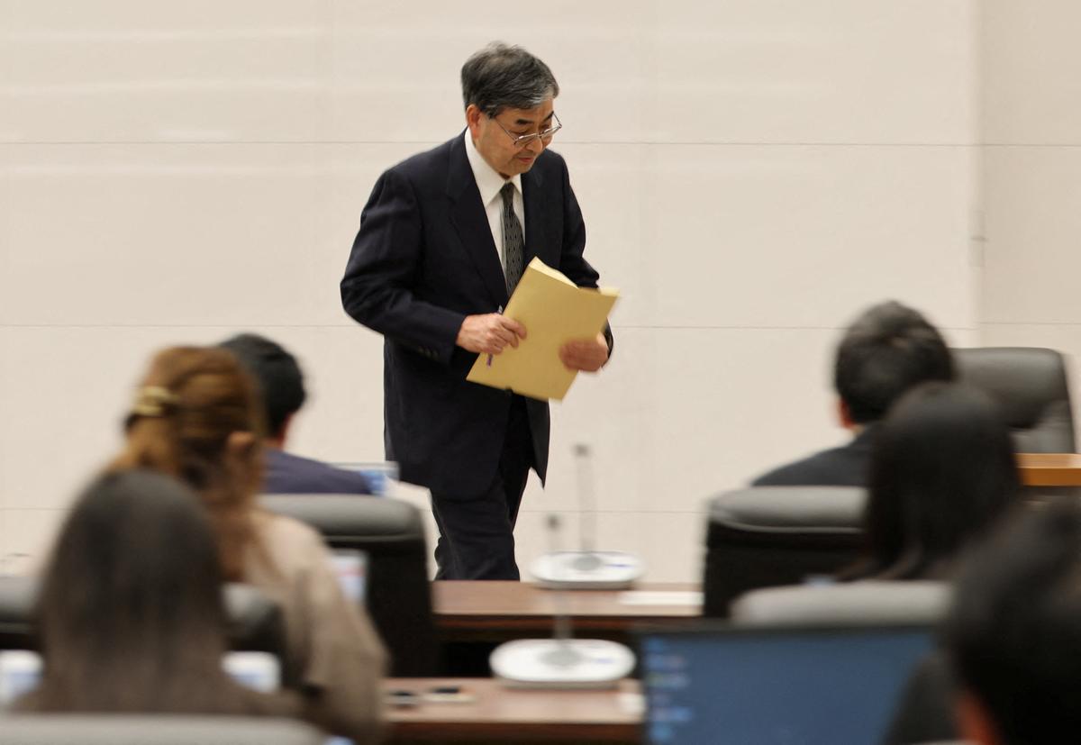 The Bank of Japan's (BOJ) new board member Toichiro Asada leaves from his inaugural press conference at BOJ headquarters in Tokyo, Japan, April 1, 2026. REUTERS/Issei Kato
