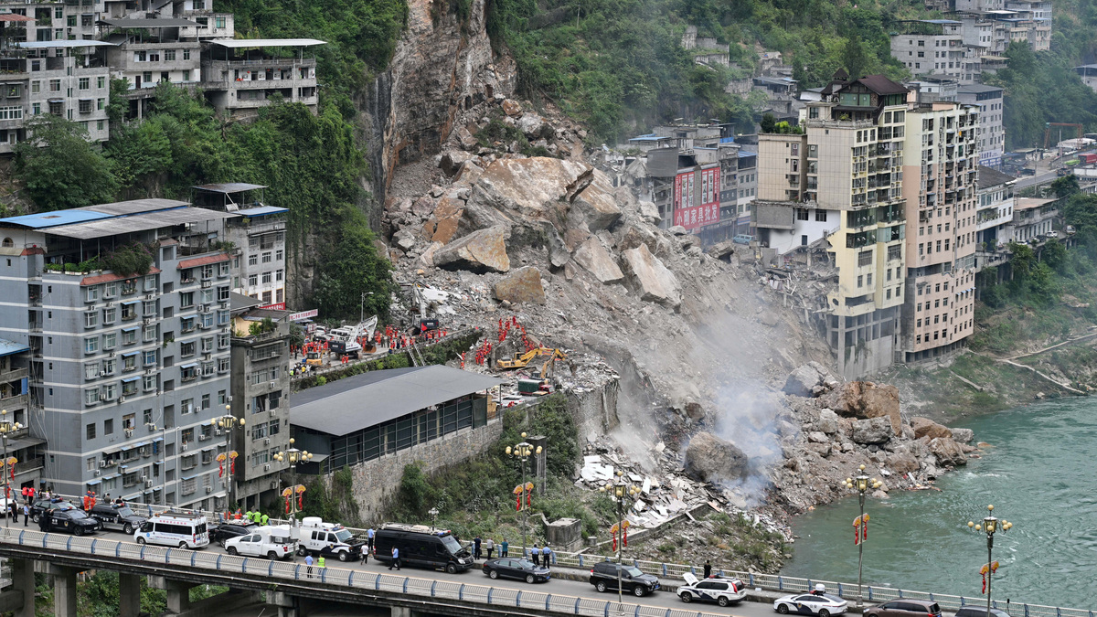 Rescue workers search for survivors at the site of a landslide along Wujiang river in Pengshui Miao and Tujia Autonomous County, Chongqing, China July 17, 2026. cnsphoto via REUTERS