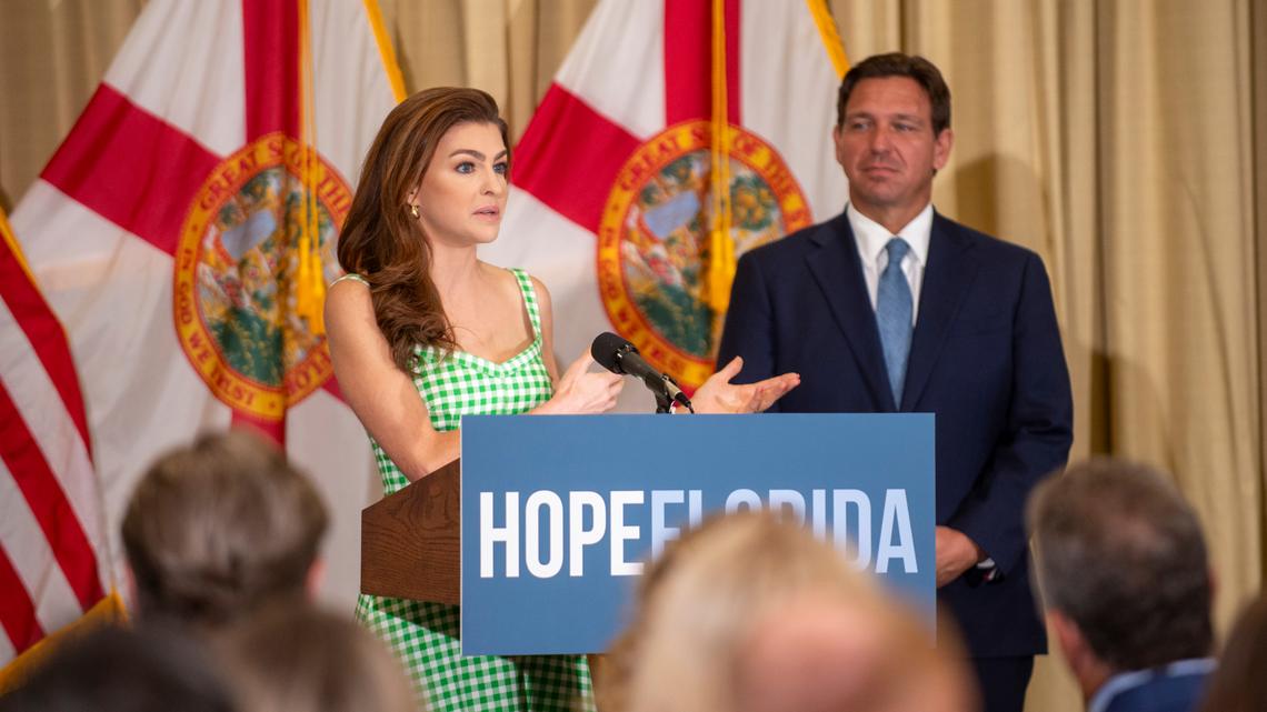 First lady Casey DeSantis speaks alongside Gov. Ron DeSantis during a news conference on July 29, 2024, in Tampa. During the conference, the governor and first lady handed out multiple checks to local churches as a part of their Hope Florida program.