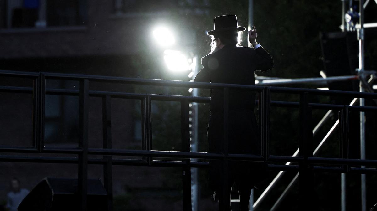 A member of the Hasidic Jewish Community in Stamford Hill, north London, delivers a speech as Jews celebrate the Lag B'Omer festival, following the stabbing of two Jewish men on April 29, and a series of arson attacks on Jewish targets since March, in London, Britain, May 5, 2026. REUTERS/Toby Shepheard