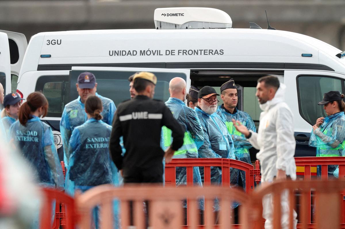 Security and health officials operate at the port of Granadilla de Abona following the arrival of the cruise ship MV Hondius after being affected by a hantavirus outbreak, in Tenerife, Spain, May 10, 2026. REUTERS/Hannah McKay