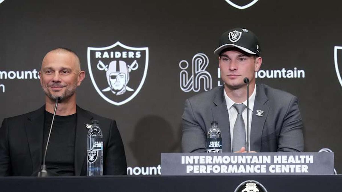  Apr 24, 2026; Henderson, NV, USA; Las Vegas Raiders quarterback Fernando Mendoza (center) speaks at introductory press conference at Intermountain Health Performance Center flanked by general manager John Spytek (left) and head coach Klint Kubiak after being selected as the No. 1 pick in the 2026 NFL Draft. Mandatory Credit: Kirby Lee-Imagn Images | Kirby Lee-Imagn Images 
