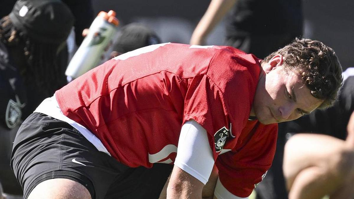  May 20, 2026; Henderson, NV, USA; Las Vegas Raiders quarterback Fernando Mendoza (15) stretches during organized team activities at Intermountain Health Performance Center. Mandatory Credit: Candice Ward-Imagn Images | Candice Ward-Imagn Images 