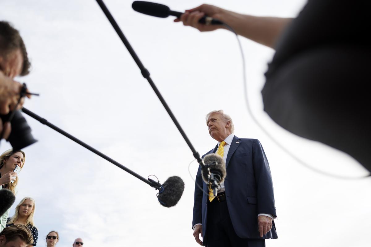 President Donald Trump speaks to reporters at Palm Beach International Airport in West Palm Beach, Florida on Saturday, May 2, 2026. About the debt surpassing growth, a White House spokesman claimed the government's fiscal health had improved under the president. (Tom Brenner/The New York Times)
