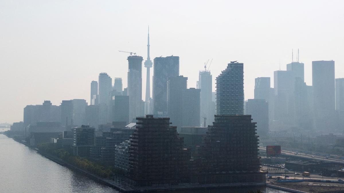 A hazy view of the skyline in Toronto, Ontario, Canada, July 14, 2025. REUTERS/Carlos Osorio