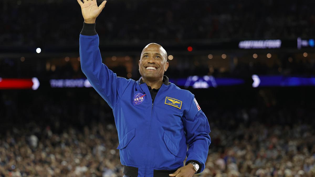 Astronaut Victor Glover reacts prior to the game between the San Diego State Aztecs and Connecticut Huskies during the NCAA Men's Basketball Tournament National Championship game at NRG Stadium on April 3, 2023, in Houston, Texas. (Carmen Mandato/Getty Images/TNS)