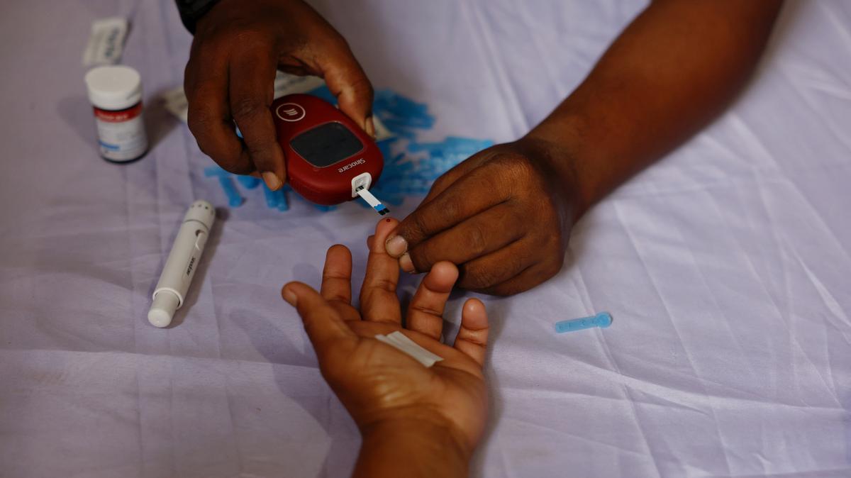 FILE PHOTO: A person receives a free blood sugar test during a campaign to mark the World Diabetes Day in Dhaka, Bangladesh, November 14, 2024. REUTERS/Mohammad Ponir Hossain/ File Photo