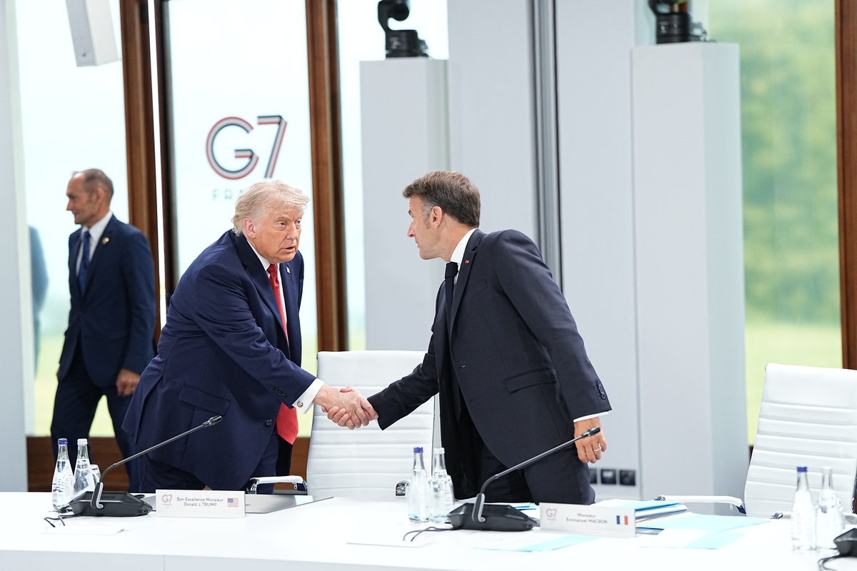 President Donald Trump and President Emmanuel Macron of France greet one another, at the G7 Summit in Evian-les-Bains, France, on Wednesday, June 17, 2026. (Haiyun Jiang/The New York Times)