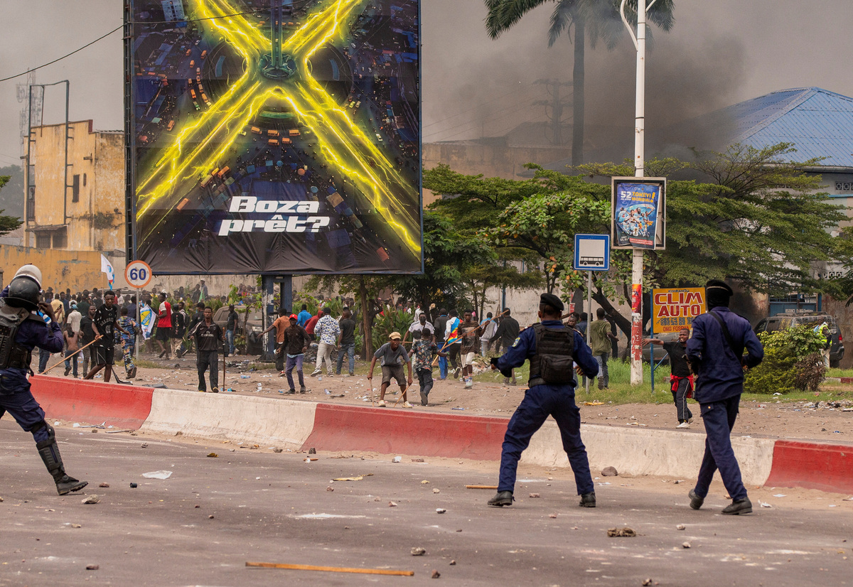 Security forces disperse a crowd of protesters near the parliament building in Kinshasa, Democratic Republic of Congo, June 12, 2026.    REUTERS/Aristote Lokinda