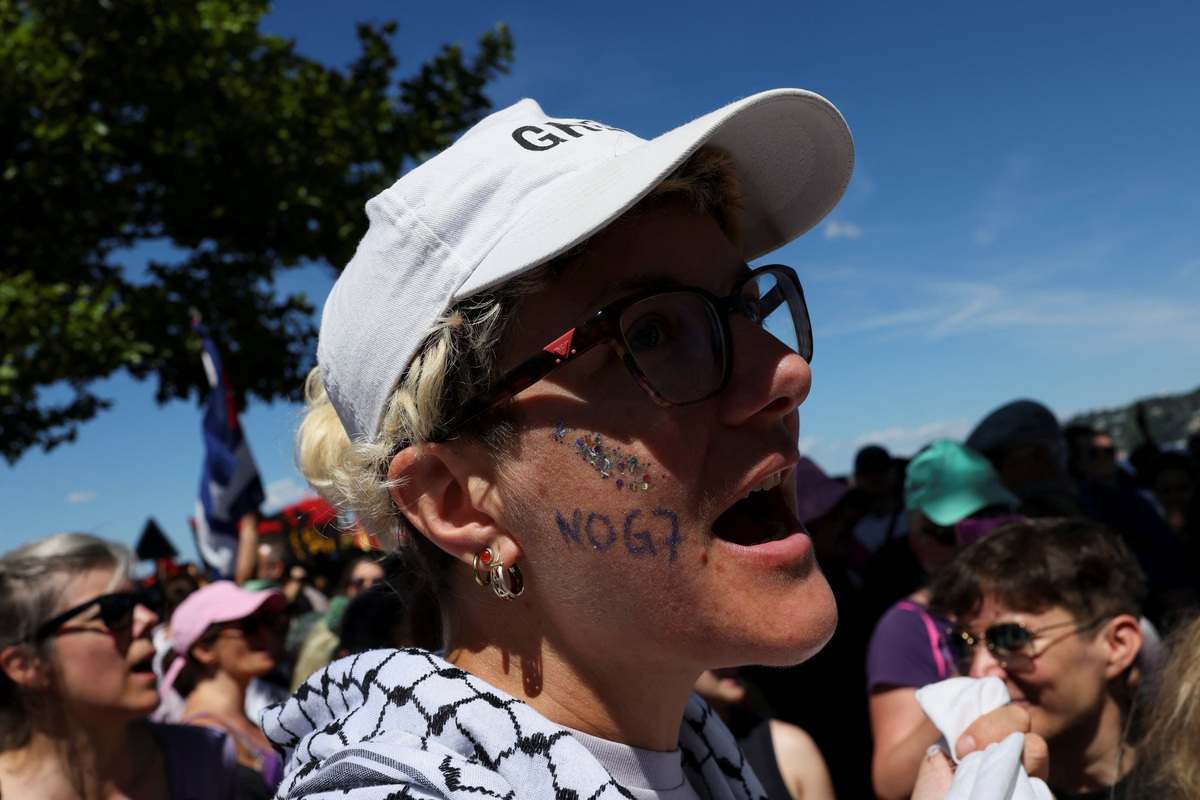 People attend a protest against the upcoming G7 summit in Evian-les-Bains in France, in Geneva, Switzerland, June 14, 2026. REUTERS/Umit Bektas