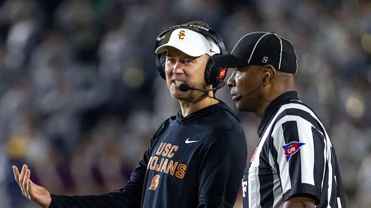  Oct 18, 2025; South Bend, Indiana, USA; Southern California Trojans head coach Lincoln Riley talks to an official during the first half against the Notre Dame Fighting Irish at Notre Dame Stadium. Mandatory Credit: Michael Caterina-Imagn Images | Michael Caterina-Imagn Images 