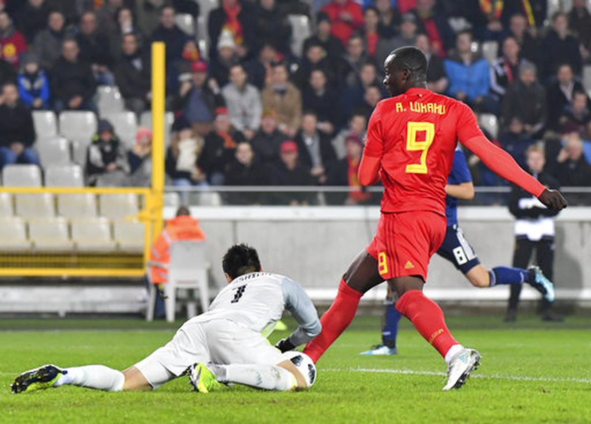 Japan's goalkeeper Eiji Kawashima, left, makes a save on a shot taken by Belgium's Romelu Lukaku during a international friendly on Nov. 14, 2017.