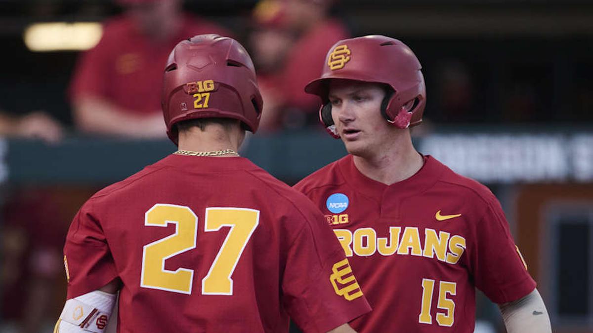  May 31, 2025; Corvallis, OR, USA; USC infielder Ethan Hedges (15) encourage infielder Bryce Martin-Grudzielanek (27) during the fifth inning after hitting his second home run of the game at the NCAA Corvallis Regional at Goss Stadium. Mandatory Credit: Troy Wayrynen-Imagn Images | Troy Wayrynen-Imagn Images 
