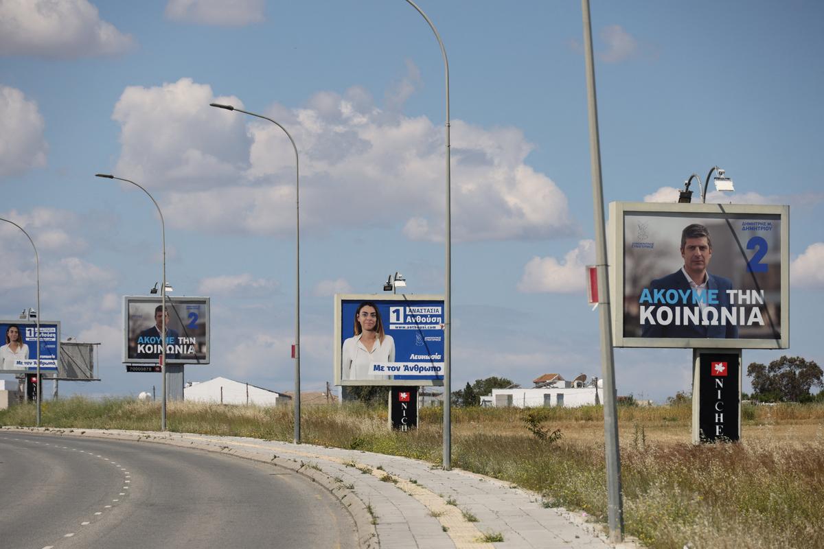 Election campaign billboards of candidates for Cyprus parliamentary election, to be held on May 24, are placed on a street in Nicosia, Cyprus May 6, 2026. REUTERS/Yiannis Kourtoglou