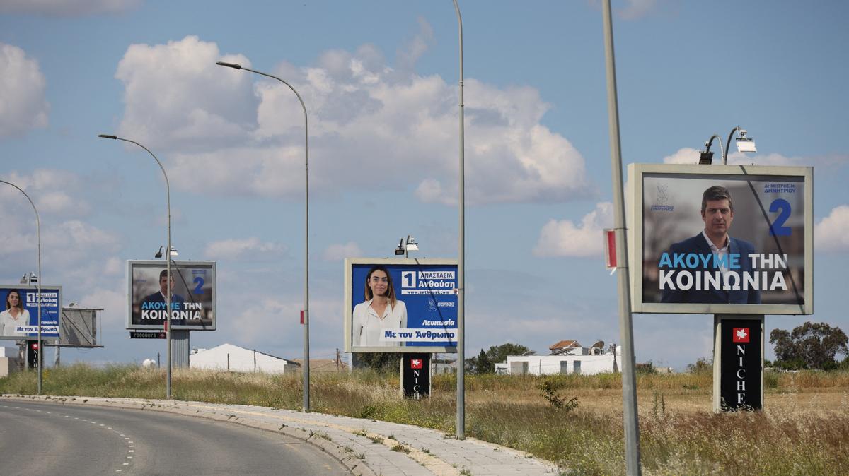 Election campaign billboards of candidates for Cyprus parliamentary election, to be held on May 24, are placed on a street in Nicosia, Cyprus May 6, 2026. REUTERS/Yiannis Kourtoglou