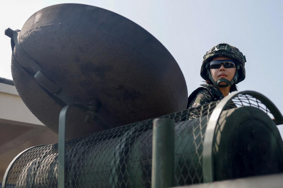 FILE PHOTO: A soldier sits atop an AAV7 amphibious assault vehicle during an annual military exercise ahead of the Lunar New Year, in Kaohsiung, Taiwan, January 29, 2026. REUTERS/Ann Wang/File Photo