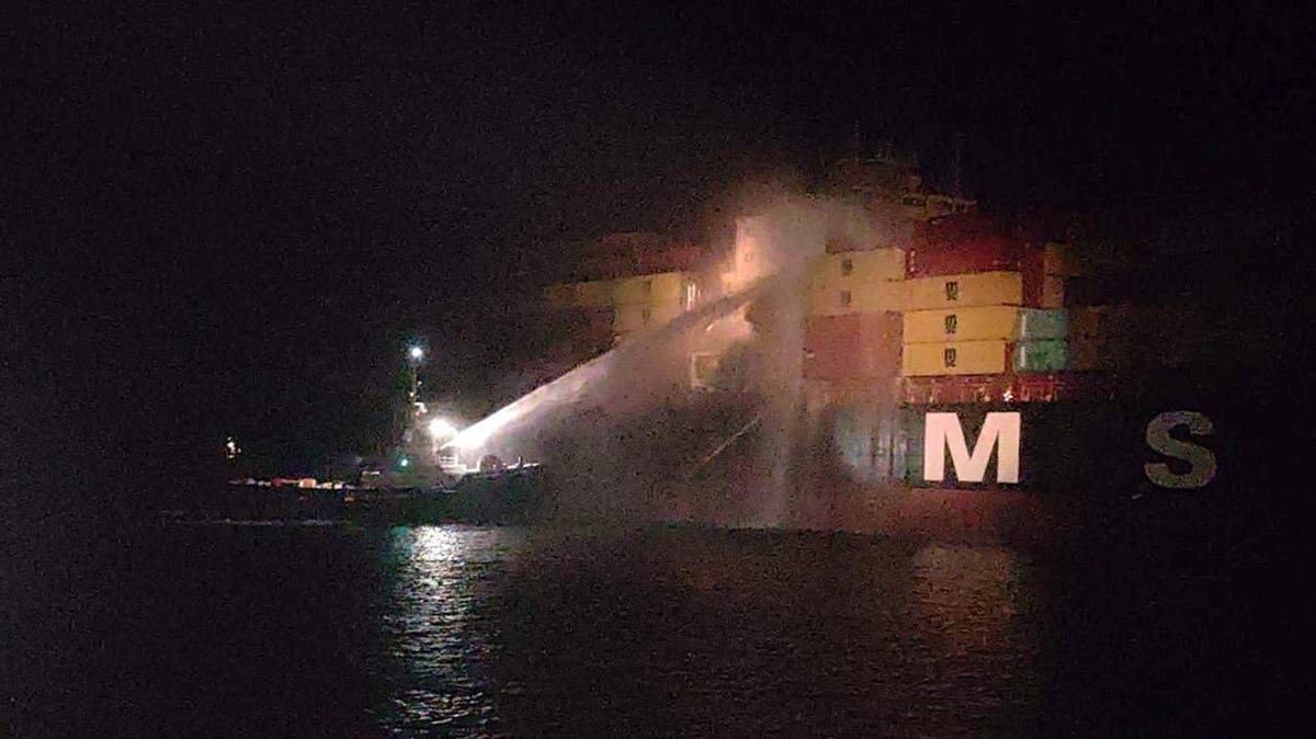 Personnel on a boat work to extinguish a fire on the Sariska V vessel in the Persian Gulf after MSC, the world's largest shipping group, said the vessel was struck by two projectiles in Iraq's Umm Qasr port, on Tuesday. Hostilities between the U.S. and Iran flared up again on Tuesday as peace negotiations remain stuck in limbo.
