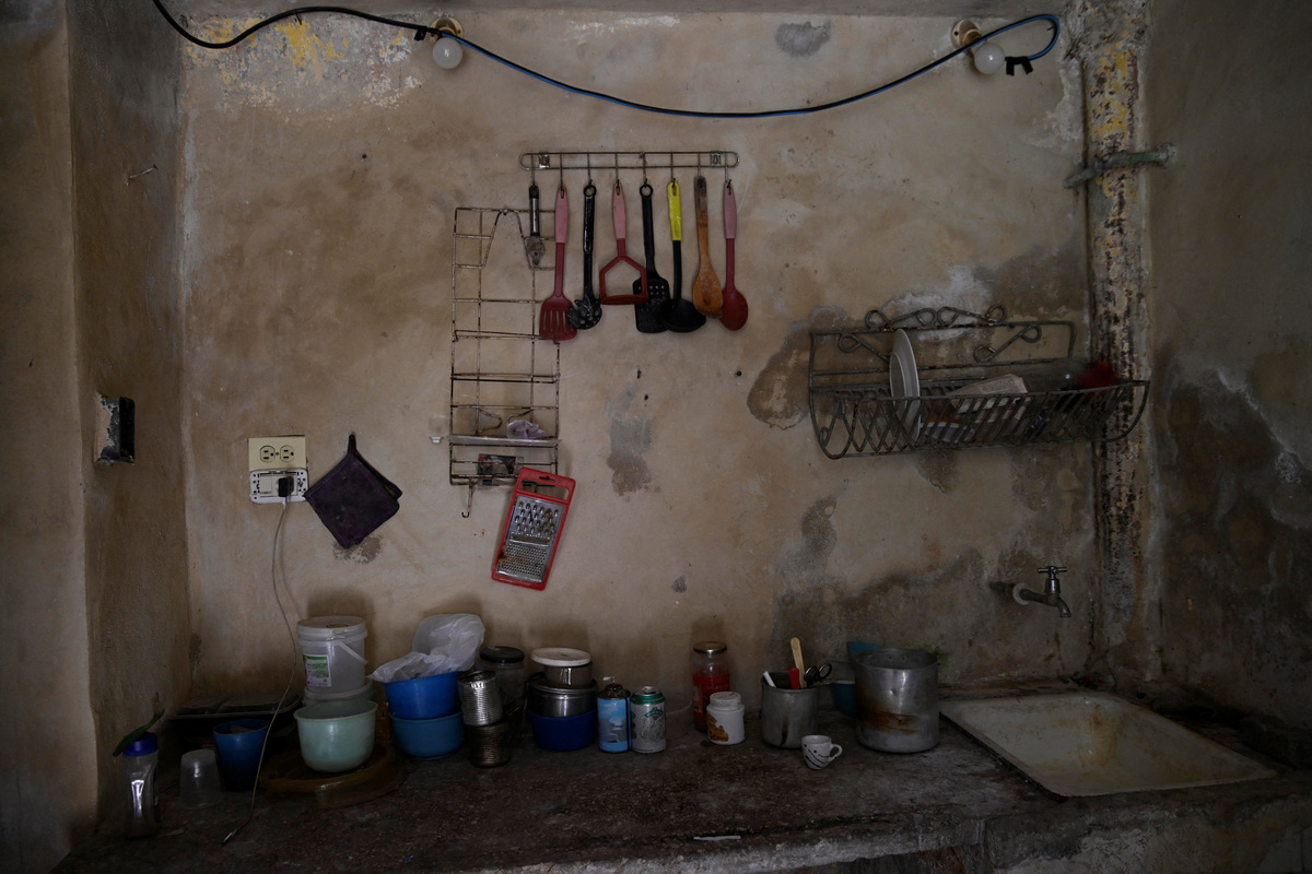 Cooking utensils hang on the wall in the kitchen of Sagrado Armando Garcia, 85, a retired government bureaucrat, in Havana, Cuba, April 28, 2026. Cuba has struggled for years under U.S. sanctions to provide basic services. Garcia said shortages have left him struggling to meet basic needs after decades working in the state system. "They are leaving us to our fate," he said. REUTERS/Norlys Perez