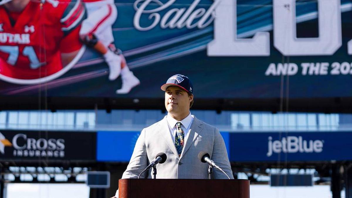  May 7, 2026; Foxborough, MA, USA; New England Patriots first round draft pick Caleb Lomu addresses the media during a press conference on the game field at Gillette Stadium. Mandatory Credit: Natalie Reid-Imagn Images | Natalie Reid-Imagn Images 