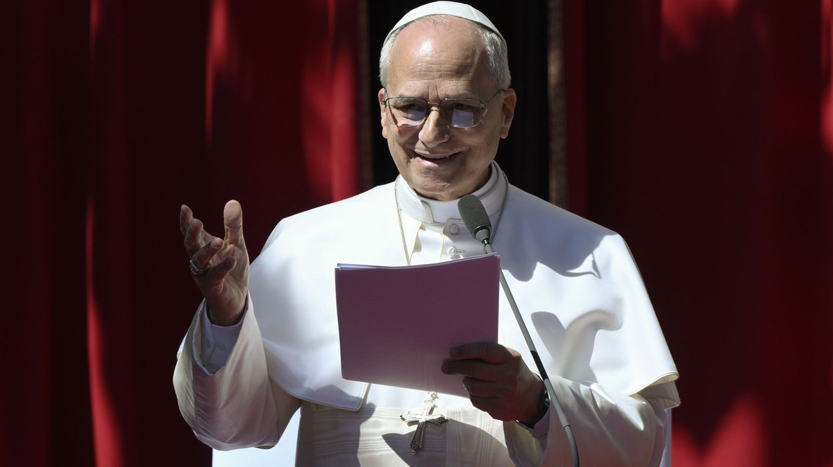 Pope Leo XIV meets with young people and catechumen in the area in front of the church of St. Devote in Monaco on Saturday.