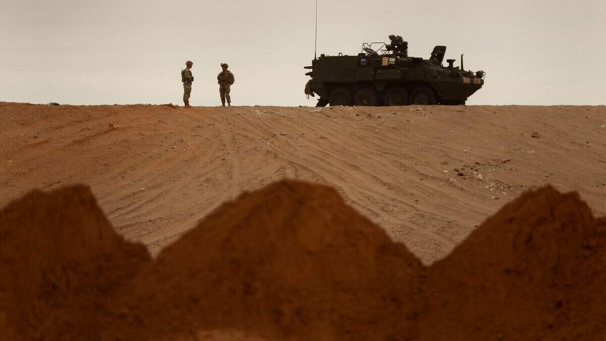 U.S. Army soldiers guard the construction of a secondary border wall in Santa Teresa, New Mexico, as seen from Ciudad Juarez, Chihuahua, Mexico, on Nov. 18, 2025.
