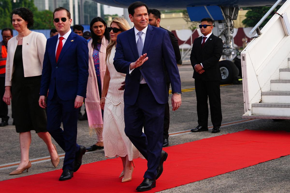 U.S. Secretary of State Marco Rubio waves as he disembarks his plane at Netaji Subhash Chandra Bose International Airport in Kolkata, India, Saturday, May 23, 2026.  Julia Demaree Nikhinson/Pool via REUTERS