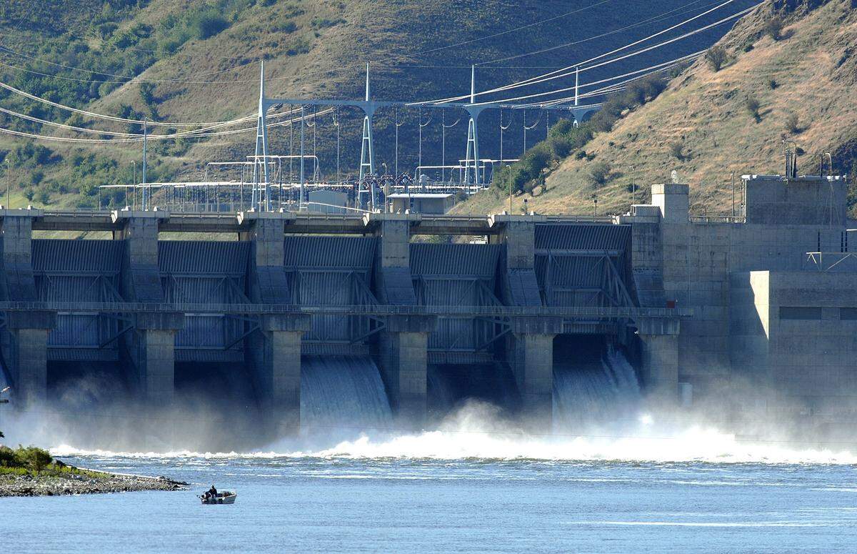 Water spills at Lower Granite Dam, one of the four dams on the lower Snake River salmon advocates have targeted for breaching. A new federal draft report addresses the idea of breaching dams.