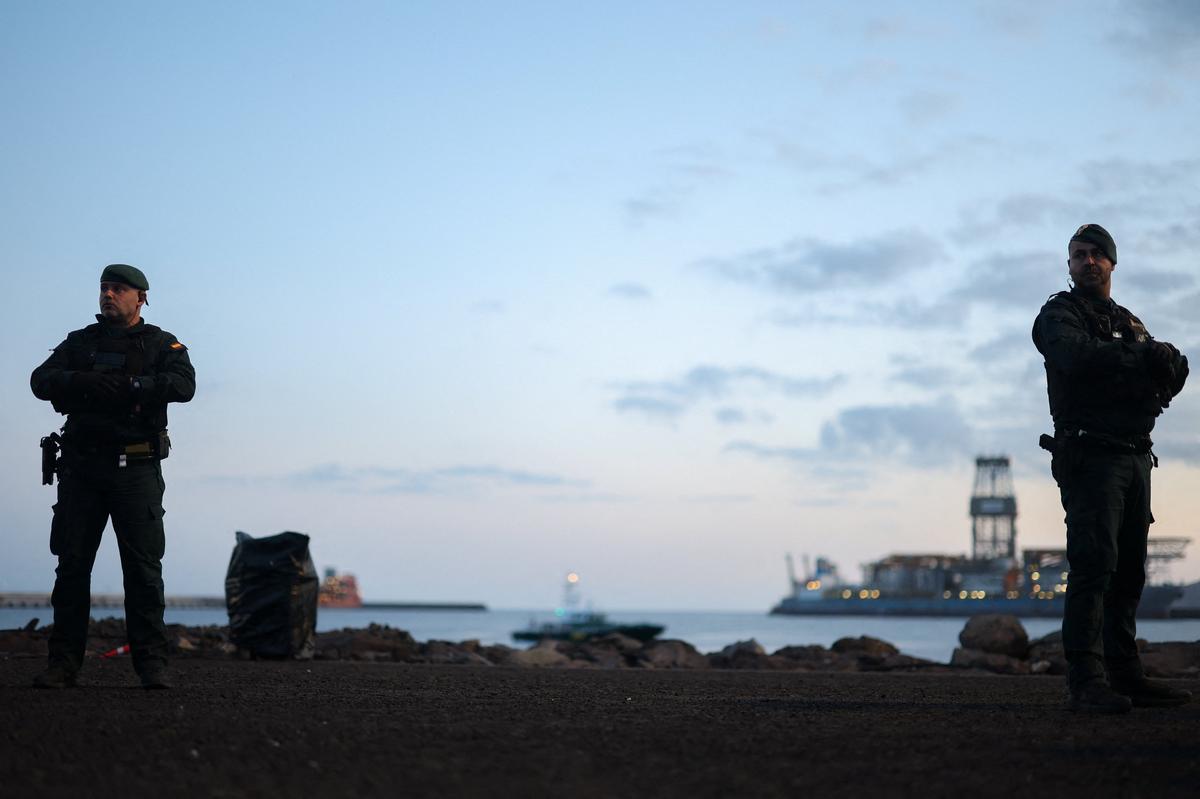 Members of the Spanish Civil Guard stand guard at the port of Granadilla de Abona, where the cruise ship MV Hondius is expected to dock after being affected by a hantavirus outbreak, in Tenerife, Spain, May 9, 2026. REUTERS/Hannah McKay