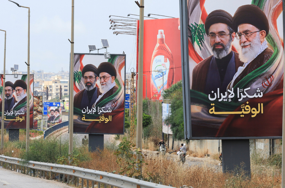 Billboards showing Iran’s new Supreme Leader Ayatollah Mojtaba Khamenei and his late father Ali Khamenei, with the slogan “Thank you to loyal Iran,” stand along the highway leading to Rafic Hariri International Airport in Beirut, Lebanon June 22, 2026.REUTERS/Mohamed Azakir