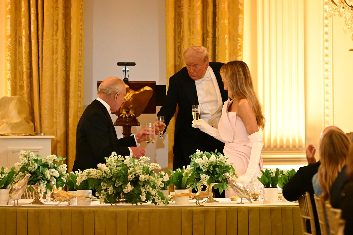 King Charles III of the United Kingdom, left, shares a toast with President Donald Trump and first lady Melania Trump during a state dinner in the East Room of the White House in Washington, on Tuesday, April 28, 2026. (Kenny Holston/The New York Times)