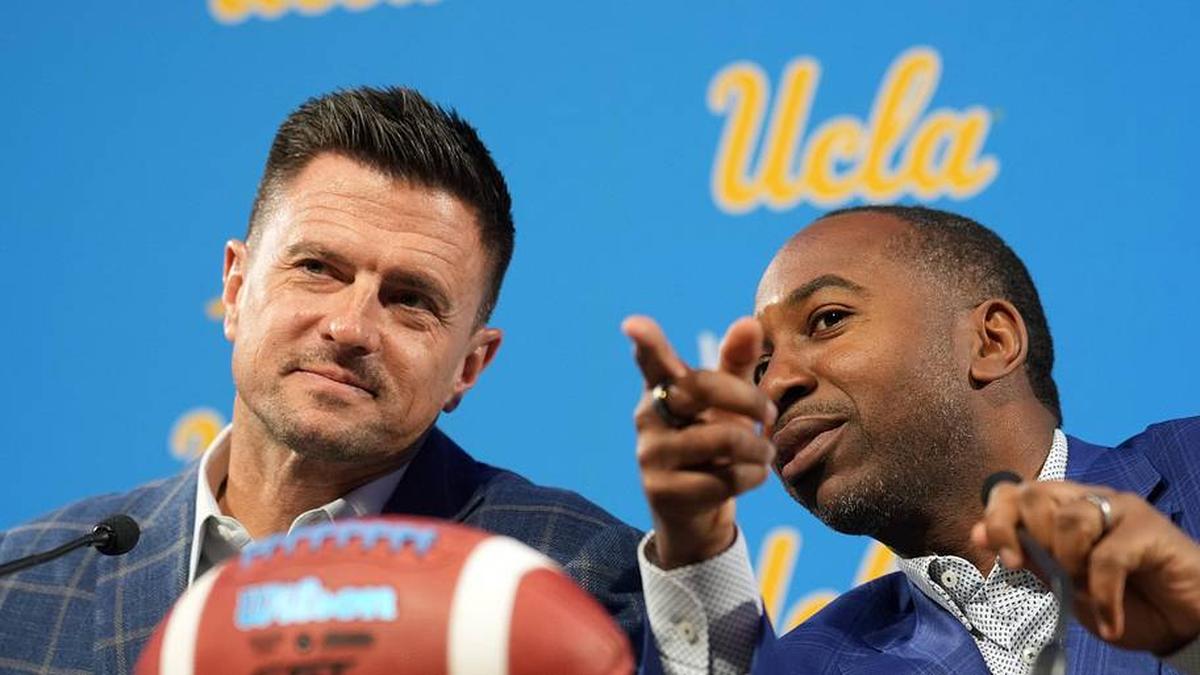  Dec 9, 2025; Los Angeles, CA, USA; UCLA Bruins football coach Bob Chesney (left) and athletic director Martin Jarmond at introductory press conference at Renee Luskin Conference Center Centennial Ballroom. Mandatory Credit: Kirby Lee-Imagn Images | Kirby Lee-Imagn Images 