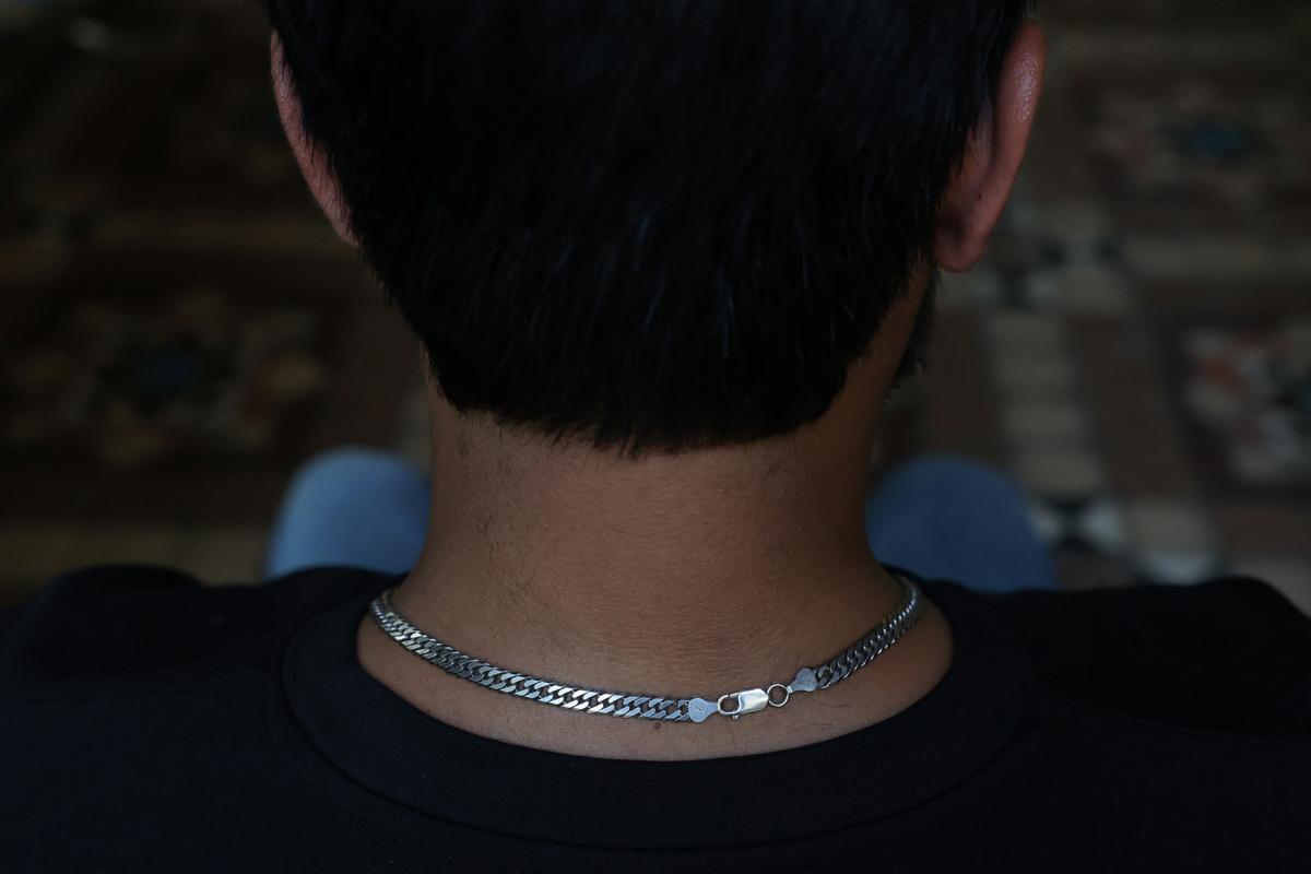 A 38-year-old Shi'ite Muslim, resident of Chakwal and former Dubai Metro manager, who was deported after 16 years in the United Arab Emirates, along with many others following the U.S.-Israeli war against Iran, poses in Karachi, Pakistan, May 12, 2026. REUTERS/Akhtar Soomro