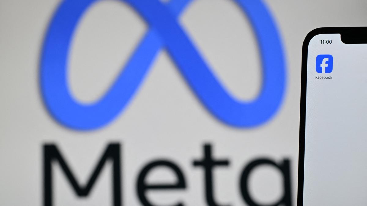 A Meta logo is displayed on a laptop screen next to the Facebook app on a phone screen. Holding platforms civilly liable for speech-based design choices undermines First Amendment rights and risks chilling online expression.