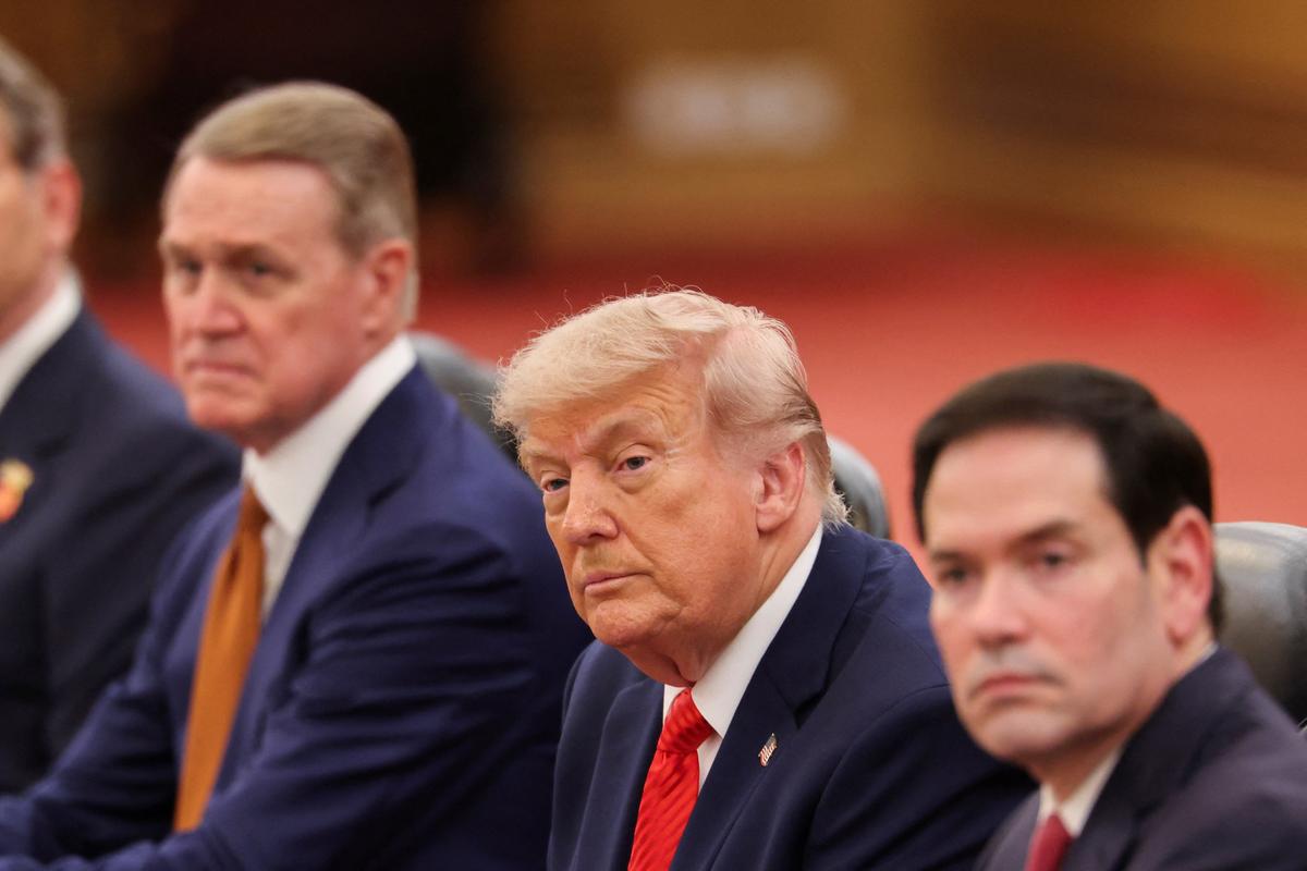 U.S. President Donald Trump, seated next to U.S. Secretary of State Marco Rubio and U.S. Ambassador to China David Perdue, attends a bilateral meeting with Chinese President Xi Jinping (not pictured) at the Great Hall of the People, in Beijing, China May 14, 2026. REUTERS/Maxim Shemetov/Pool