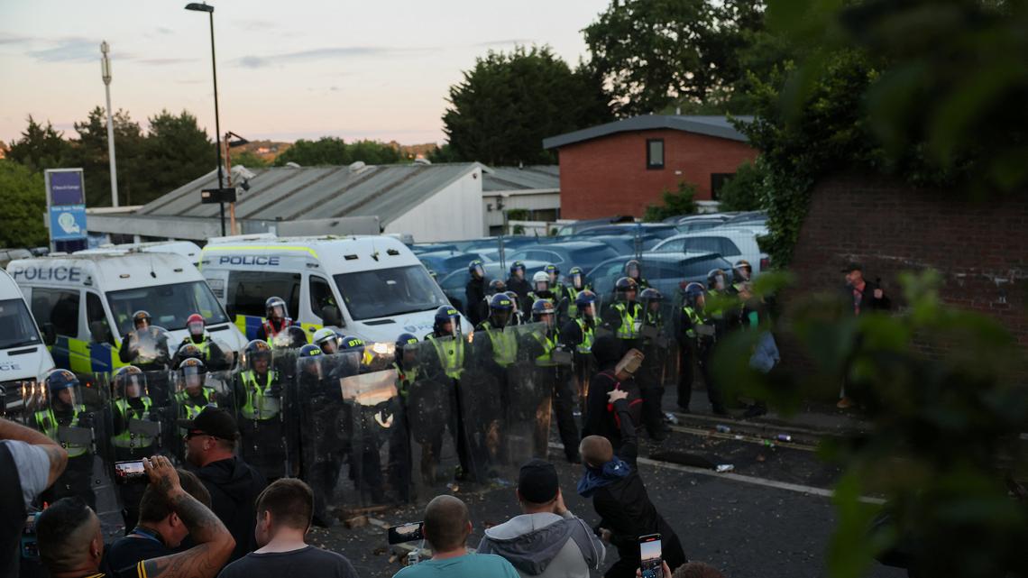 UK interior minister condemns violent reaction to handcuffed student's murder 