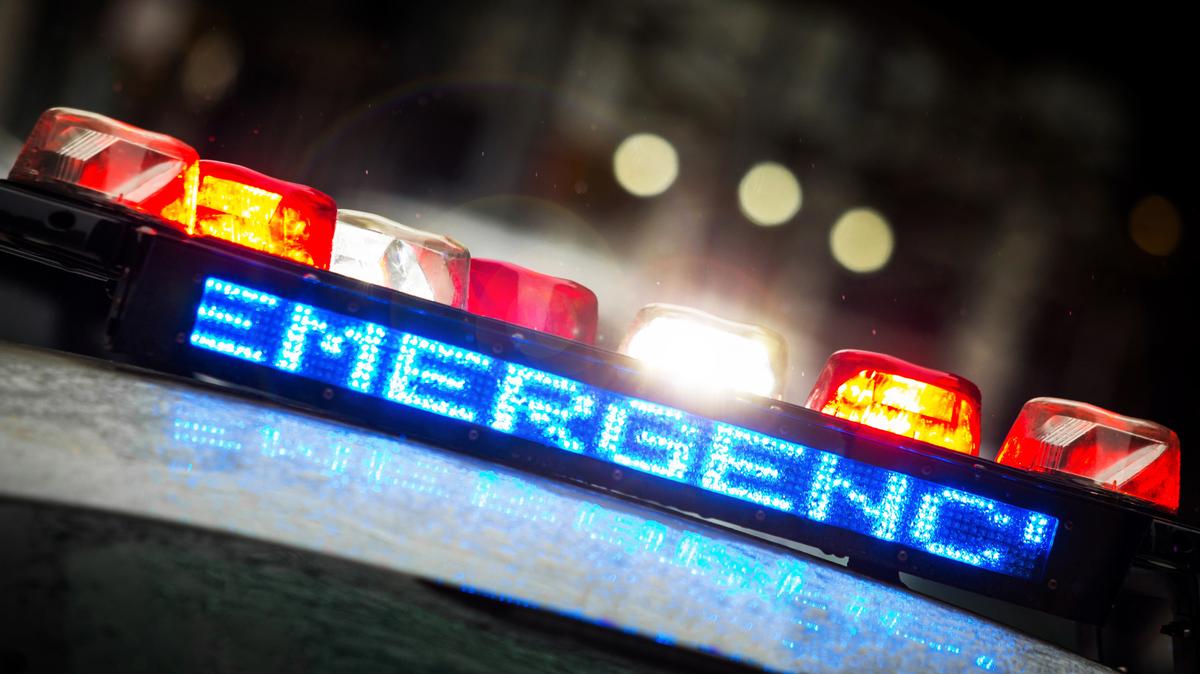 A woman died after an ambulance with a Tri-Cities area driver crashed into a disabled car on Interstate 82, according to a police report.