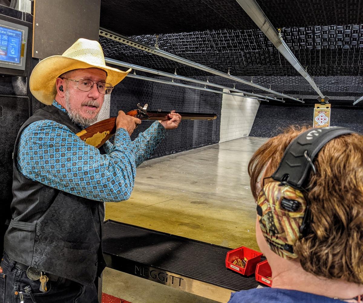  Scott McEndree, the range manager for Cody Firearms Experience, demonstrates how to shoot a Civil War-era rifle. Photo credit: Cindy Richards 