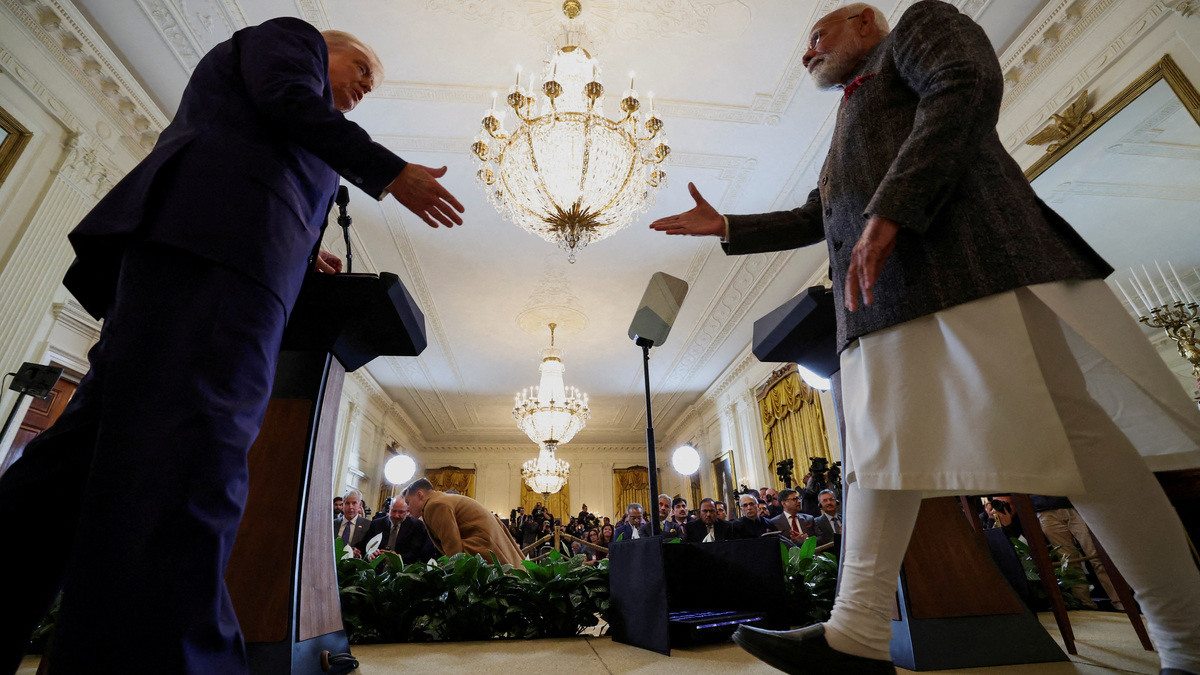 FILE PHOTO: U.S. President Donald Trump and Indian Prime Minister Narendra Modi prepare to shake hands as they attend a joint press conference at the White House in Washington, D.C., U.S., February 13, 2025. REUTERS/Kevin Lamarque/File Photo
