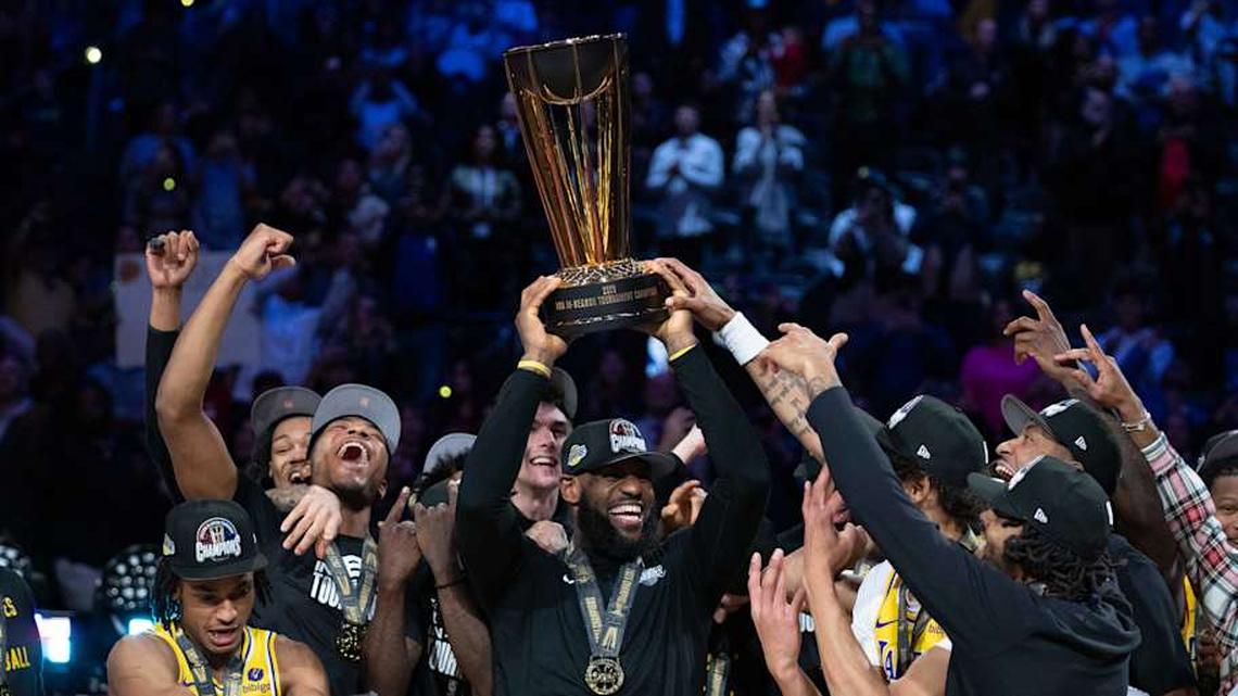  The Los Angeles Lakers celebrate with the champions trophy after the in-season tournament championship | Kyle Terada-Imagn Images 