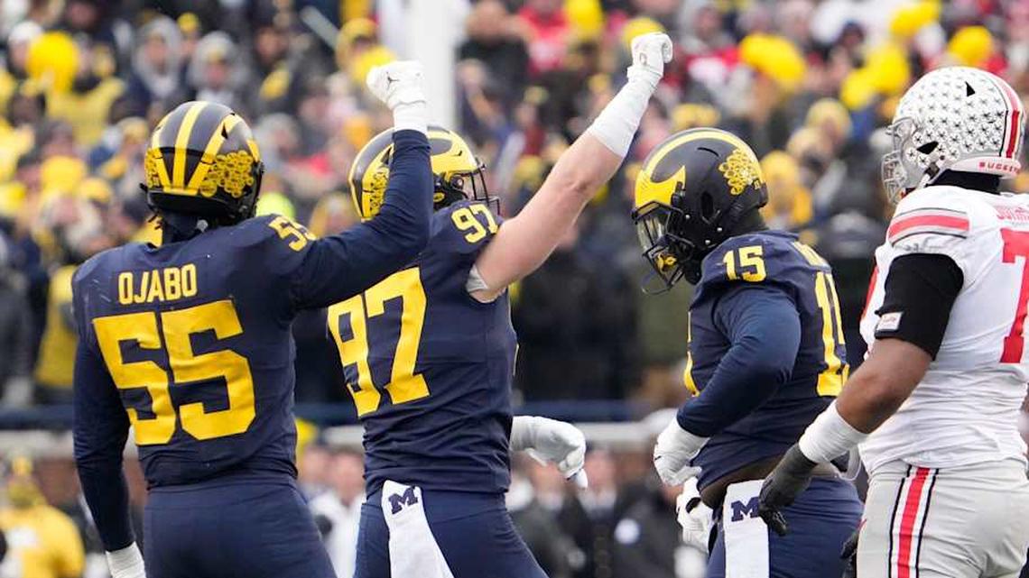  Michigan Wolverines linebacker David Ojabo (55) and defensive end Aidan Hutchinson (97) celebrate a sack of Ohio State Buckeyes quarterback C.J. Stroud (7) during the third quarter of the NCAA football game at Michigan Stadium in Ann Arbor on Saturday, Nov. 27, 2021. Oller Michigan 1 | Adam Cairns/Columbus Dispatch / USA TODAY NETWORK / USA TODAY NETWORK 