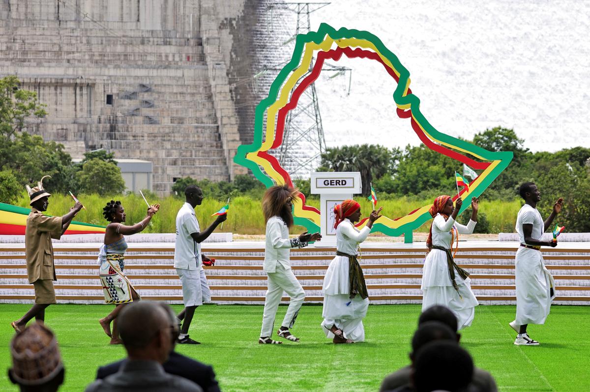 FILE PHOTO: Traditional dancers perform during the inauguration of the Grand Ethiopian Renaissance Dam (GERD) built along the Blue Nile in Guba, Benishangul-Gumuz region, Ethiopia, September 9, 2025. REUTERS/ Tiksa Negeri/File Photo