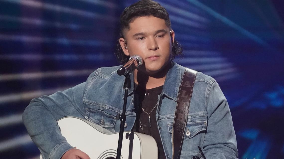 This image released by ABC shows Caleb Kennedy performing on the singing competition series “American Idol,” in Los Angeles that aired May 9. Kennedy has dropped out of the singing competition after a video circulated showing him sitting next to someone wearing what appears to be a Ku Klux Klan hood. Kennedy, advanced into the Top 5, apologized for the video on Twitter and Instagram on Wednesday, saying “it displayed actions that were not meant to be taken in that way.” (Eric McCandless/ABC via AP)