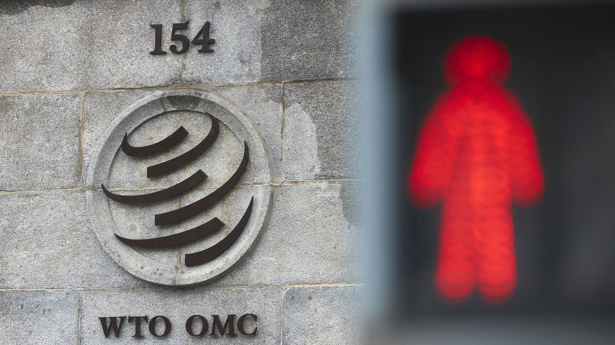 FILE PHOTO: A logo is pictured on the World Trade Organisation (WTO) building before a ministerial meeting to discuss a draft agreement on curbing subsidies for the fisheries industry in Geneva, Switzerland, July 15, 2021. REUTERS/Denis Balibouse/File Photo