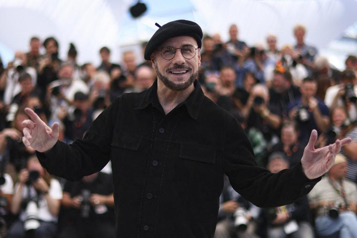 Director John Travolta poses during a photocall for the film "Propeller One-Way Night Coach" (Vol de Nuit pour Los Angeles) presented as part of Cannes Premiere at the 79th Cannes Film Festival in Cannes, France, May 16, 2026. REUTERS/Gonzalo Fuentes