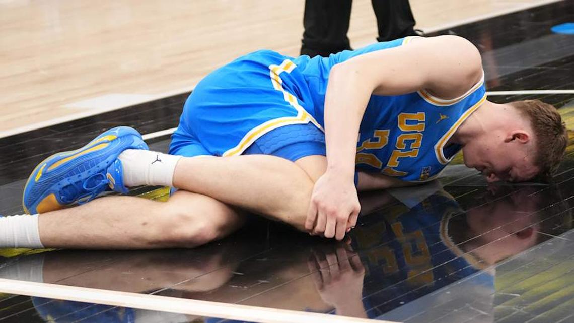  Mar 13, 2026; Chicago, IL, USA; UCLA Bruins forward Tyler Bilodeau (34) grabs his knee against the Michigan State Spartans during the first half at United Center. Mandatory Credit: David Banks-Imagn Images | David Banks-Imagn Images 