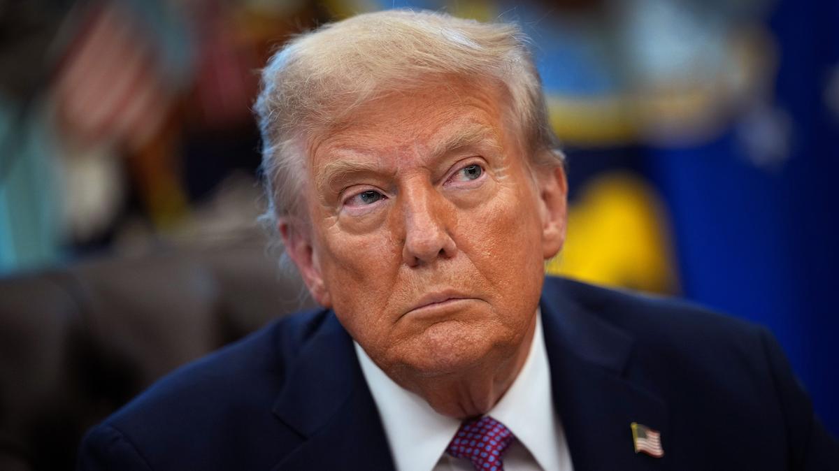 President Donald Trump speaks to reporters as he signs executive orders in the Oval Office of the White House on Sept. 5.