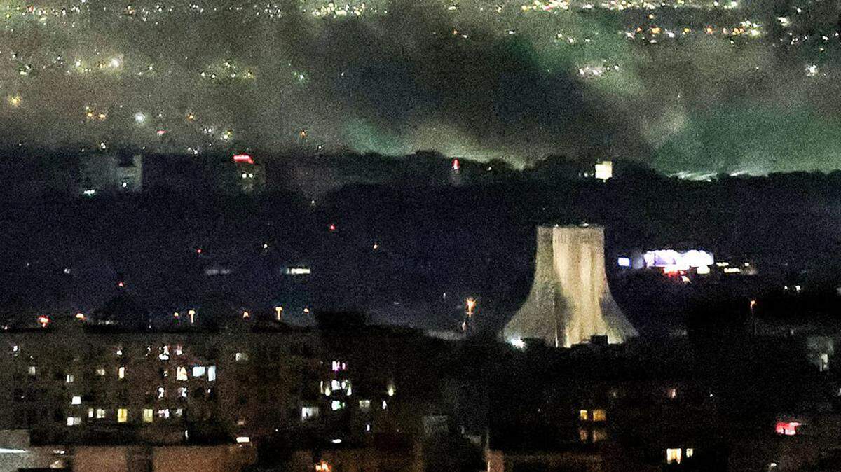 Smoke plumes billow from the site of airstrikes near Azadi Tower in western Tehran, Iran, on Tuesday. The Pentagon’s leaders said Tuesday that U.S. and Israeli forces were “winning decisively” but declined to set a timetable for the end of the conflict, saying it was for President Donald Trump to decide.