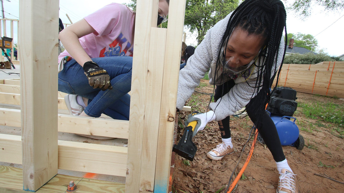 Rashawn Brooks works to help as women with Habitat for Humanity work during the initial build for a new house on Gidney Steet in Shelby Saturday, April 17, 2021.