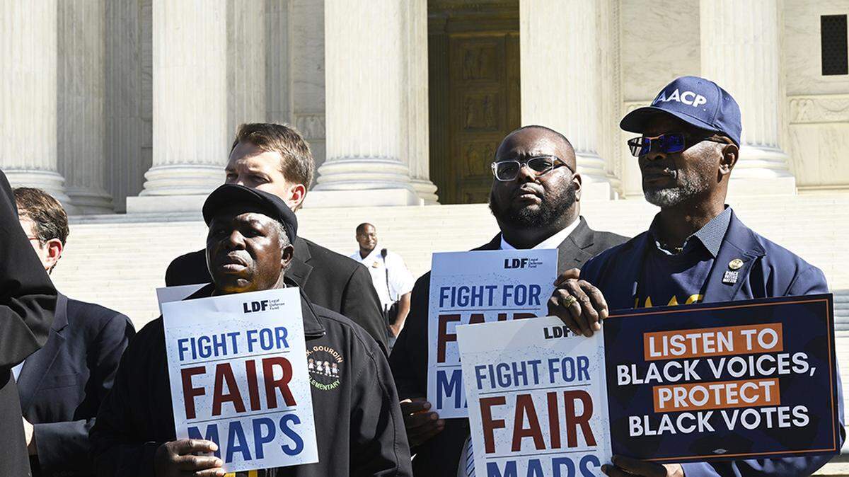 South Carolina voters attend a rally outside of the Supreme Court in Washington on Oct. 11. A divided court has overturned a lower court ruling that found South Carolina had discriminated against Black voters.