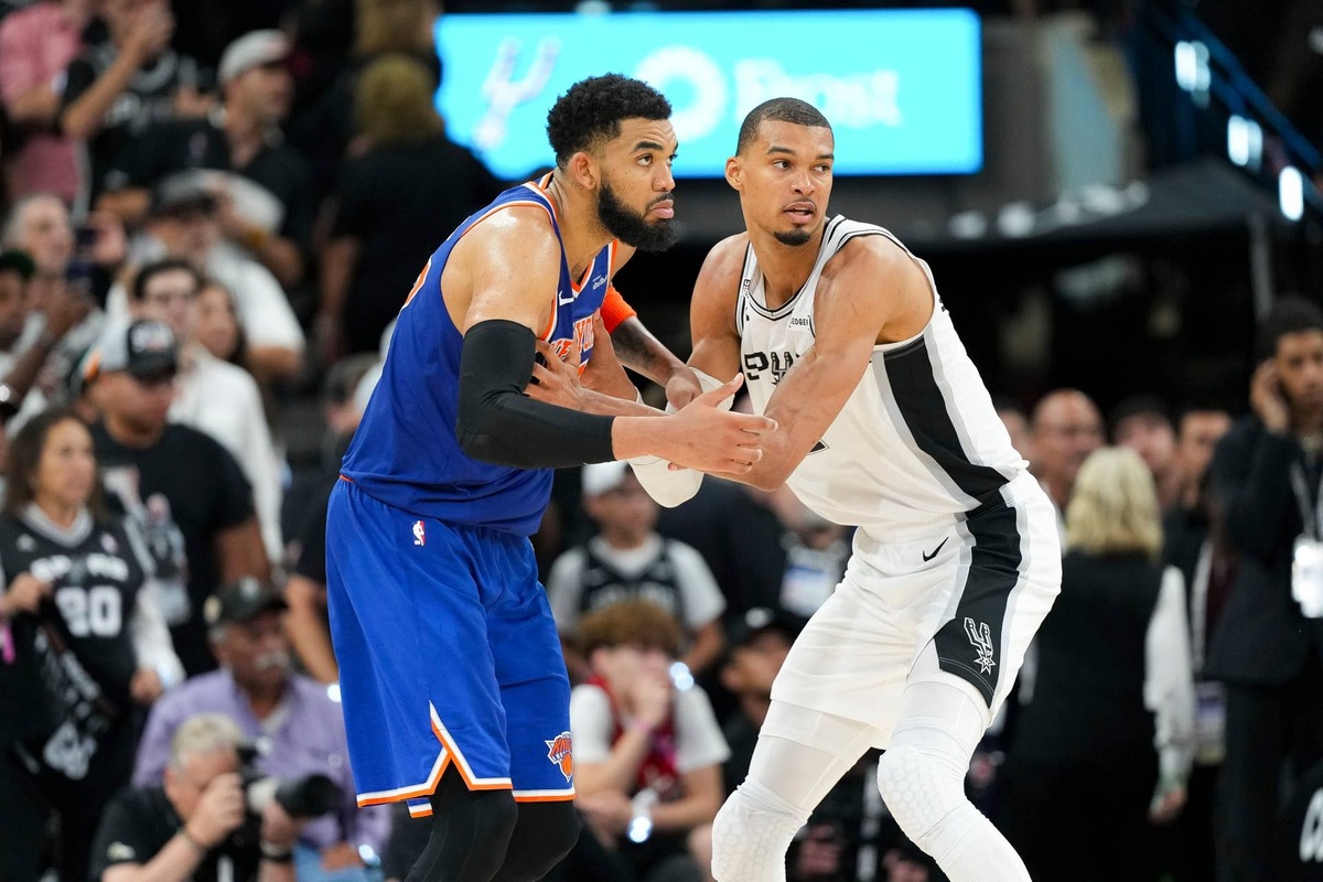  Jun 5, 2026; San Antonio, Texas, USA; New York Knicks center Karl-Anthony Towns (32) and San Antonio Spurs forward Victor Wembanyama (1) look for the ball in the second half during game two of the 2026 NBA Finals at Frost Bank Center. Mandatory Credit: Scott Wachter-Imagn Images 